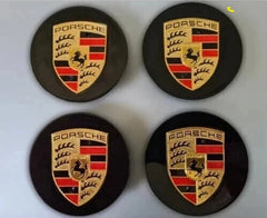 Black and gold Porsche wheel centre caps by Eliteridegear, showcasing sleek automotive wheel accessory design.