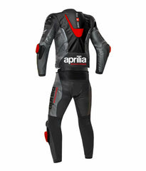 Damotogear Aprilia motorcycle racing leather suit displayed on a model, showcasing sleek black design and protective padding.