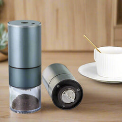 Adistore electric stainless steel coffee grinder with a sleek design and a clear lid showing ground coffee inside.