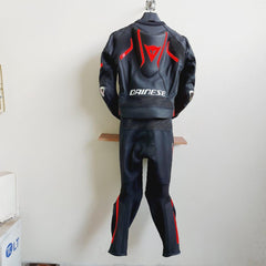 DAMOTOGEAR Laguna Seca 4 leather motorcycle suit in black and red, shown from the back with detailed stitching and protective padding.