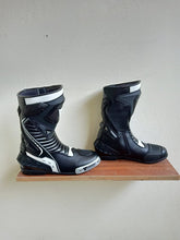 Black and white Motogp replica leather motorcycle boots by DAMOTOGEAR, featuring protective design and sporty style.