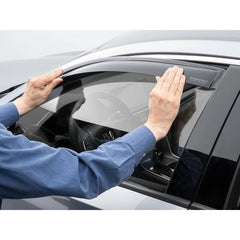 WeatherTech Chevrolet Spark side window deflectors with dark tint, front and rear set, custom fit for weather protection and style.