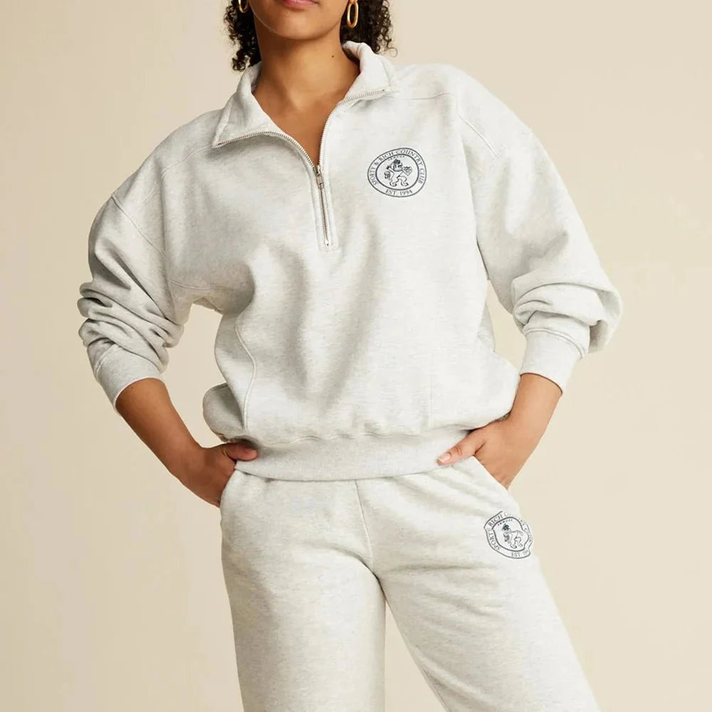 Women’s ZESSAM Club Graphic Sweatshirt by Adistore featuring long sleeves and a collar, shown in a stylish casual design.
