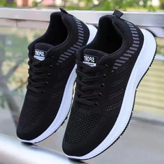 Men’s breathable sports shoes by Adistore, designed for casual running and training, featuring lightweight mesh and supportive sole.