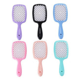Adistore detangling hair brush for wet and curly hair with massage hollow comb design, showing the brush's bristles and ergonomic shape.