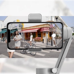 ZHIYUN SMOOTH Q3 phone stabilizer gimbal holding an iPhone for smooth video recording and stabilization.