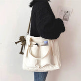 Adistore women's shopper bag with zipper, featuring a solid design, crossbody strap, and tote shoulder style.