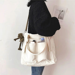 Adistore women's shopper bag with zipper, featuring a solid design, crossbody strap, and tote shoulder style.