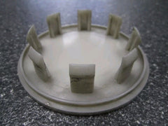 Set of four Eliteridegear Porsche rim centre caps in silver and black, showing close-up of sleek, circular wheel hub covers.