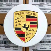 Set of four silver Porsche wheel centre caps by Eliteridegear, showcasing sleek, round design for car wheel decoration.