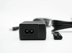 Simagic P-APS accessories power supply unit for haptic, LED, and heel-stop modules in a racing simulator setup.