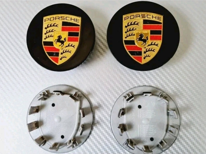 Eliteridegear Porsche wheel center caps in black and gold, featuring a sleek design for stylish vehicle enhancements.