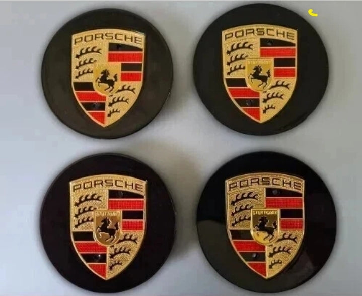 Black and gold Porsche wheel centre caps by Eliteridegear, showcasing sleek automotive wheel accessory design.