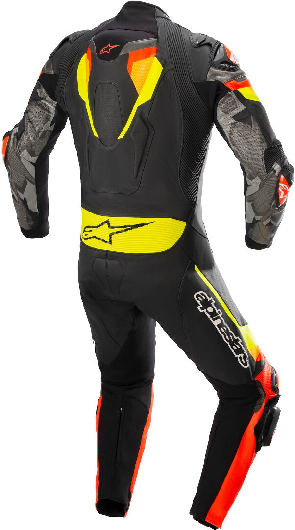 DAMOTOGEAR Atem V4 one-piece motorcycle leather suit in black, red, and yellow with protective padding and sleek design.