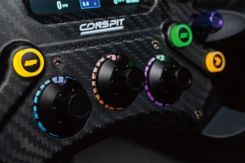 Close-up of the Trak Racer UK Conspit 300GT steering wheel showing textured grip and detailed front design.