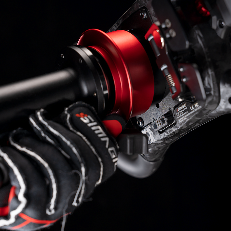 Simagic MagLink magnetic quick-release adapter for steering wheels, compatible with 50mm and 70mm QR interfaces, by Trak Racer UK.