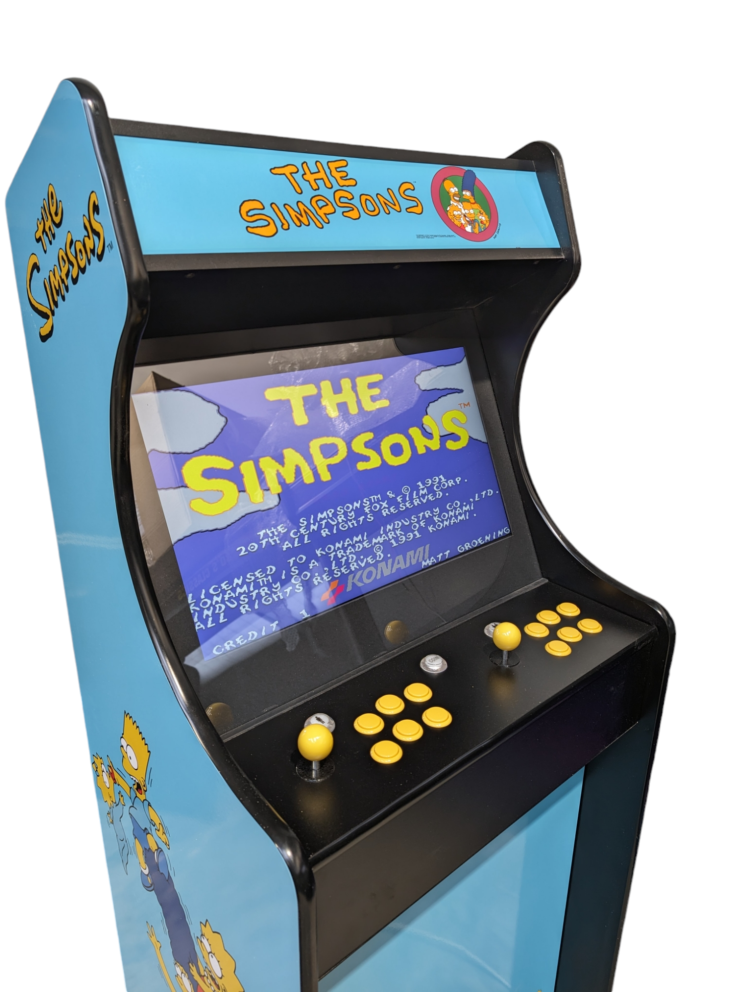 Deluxe 24 home arcade game with Simpsons theme by Roll Model Arcade, featuring colorful game cabinet and Simpsons character artwork.