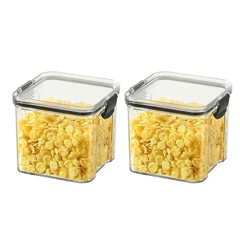 Set of Adistore airtight food storage containers with clear lids and labels for organized kitchen storage.