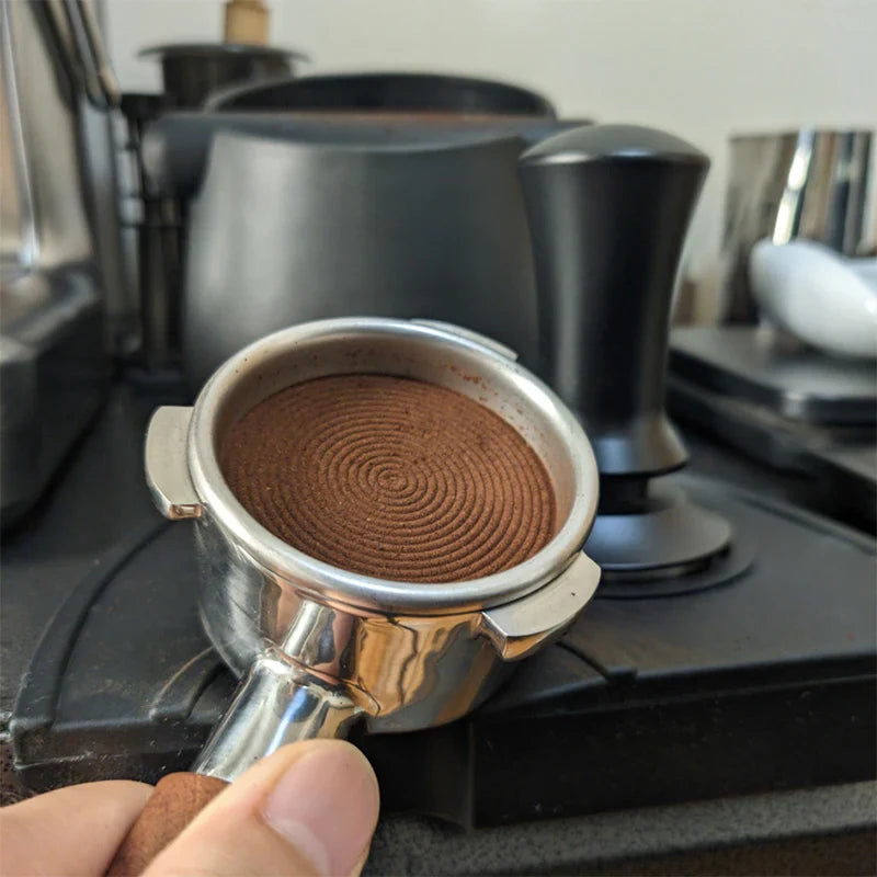 Stainless steel Adistore coffee tamper spring for espresso tamping, with ergonomic handle and durable construction.