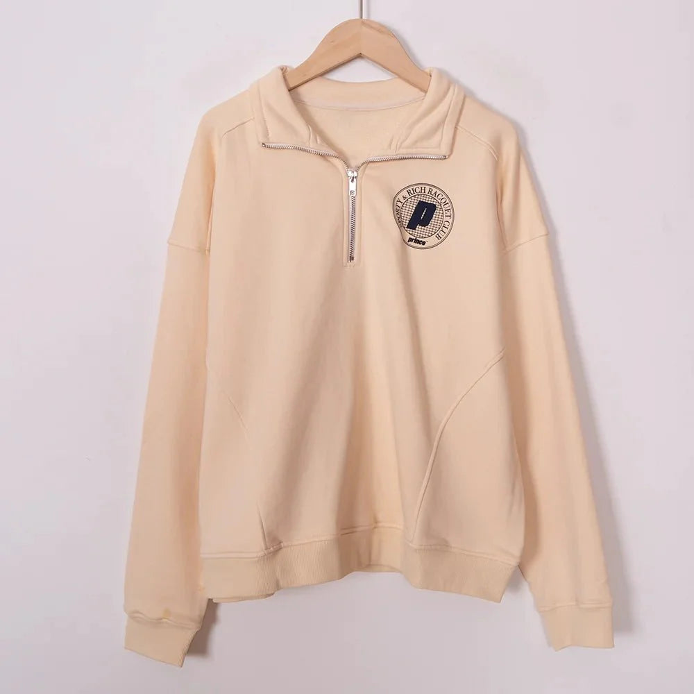 Women’s ZESSAM Club graphic sweatshirt by Adistore with long sleeves and a collar, featuring a stylish, casual design.