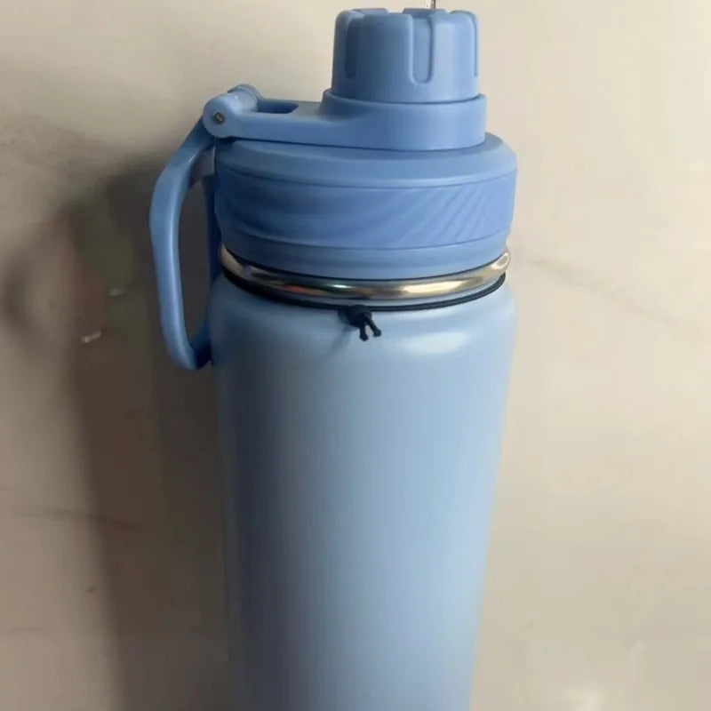 304 stainless steel insulated water bottle, 24oz vacuum sports cup with leak-proof lid by Adistore, showing sleek metallic finish.