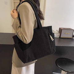 Large capacity Adistore casual corduroy shoulder handbag with zipper and tote design, showcasing its stylish, functional exterior.