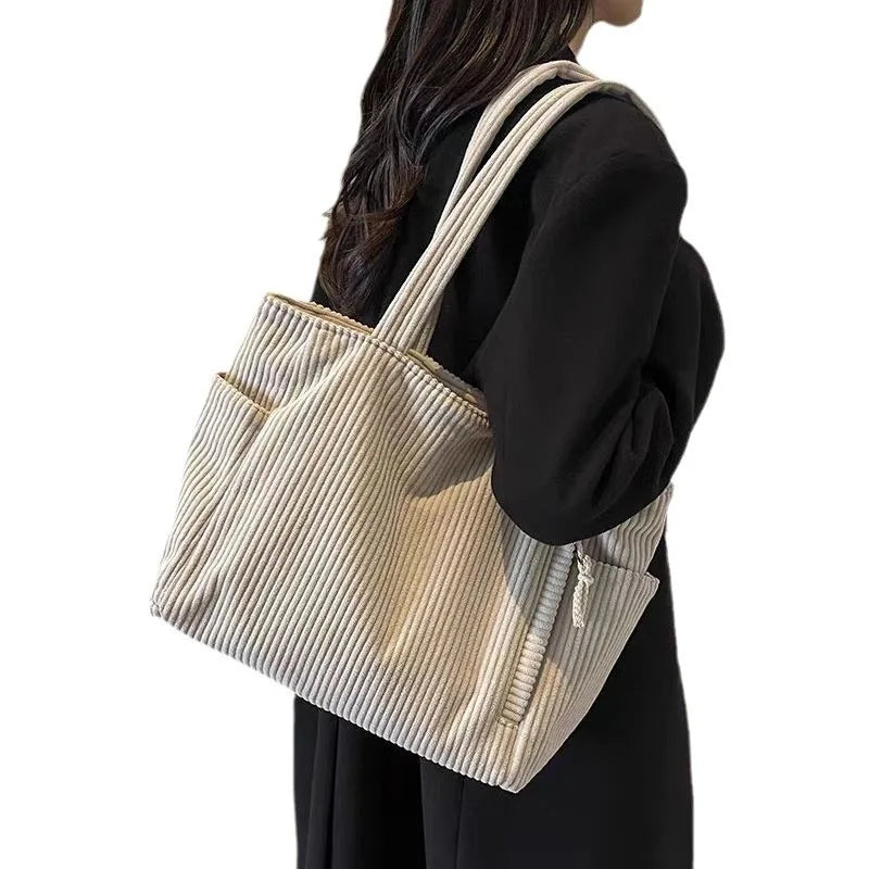 Large beige corduroy shoulder handbag with zipper closure, spacious tote style by Adistore, ideal for casual everyday use.