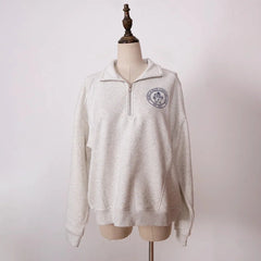 Women’s ZESSAM Club graphic sweatshirt by Adistore with long sleeves and collar, featuring a stylish design and comfortable fit.