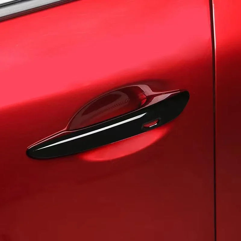 Chrome door handle cover set with ABS carbon fiber styling for a sleek, modern look on vehicle doors.