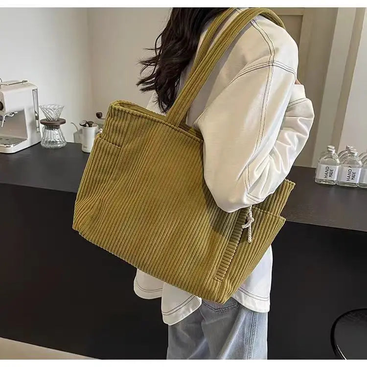 Adistore casual corduroy shoulder handbag with zipper, large capacity tote bag showing textured fabric and spacious interior.
