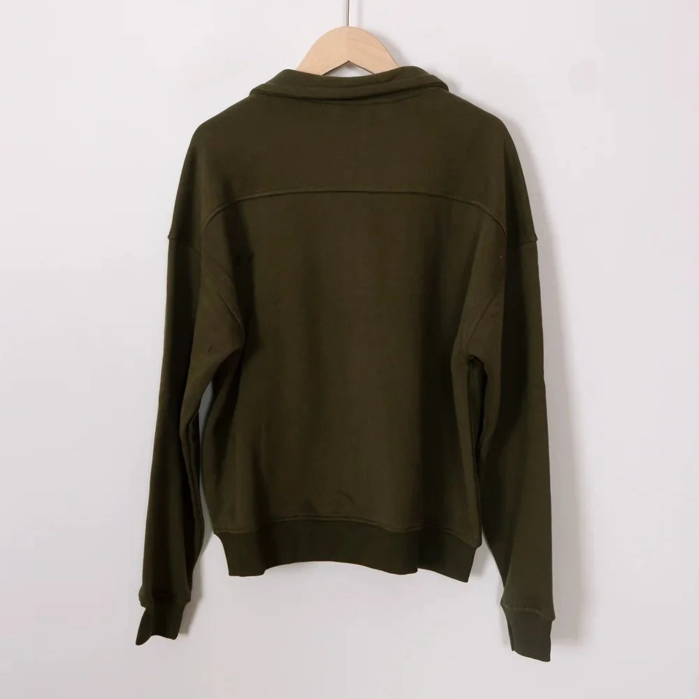 Women’s ZESSAM Club graphic sweatshirt by Adistore featuring long sleeves and a collar, displayed on a model.