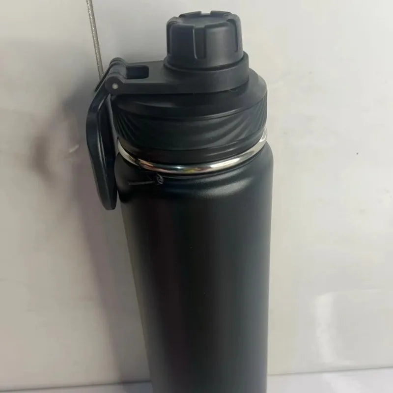 Adistore 24oz stainless steel insulated water bottle with vacuum sports cup design, featuring a sleek silver finish and leak-proof lid.