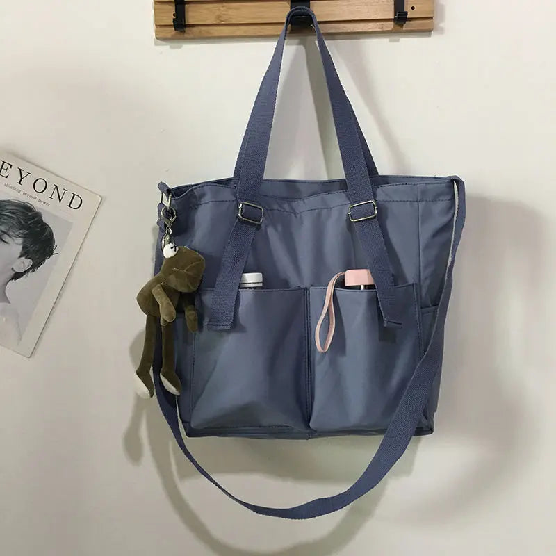 Women’s Adistore shopper bag with zippered compartment, versatile crossbody and tote shoulder bag, solid color design.
