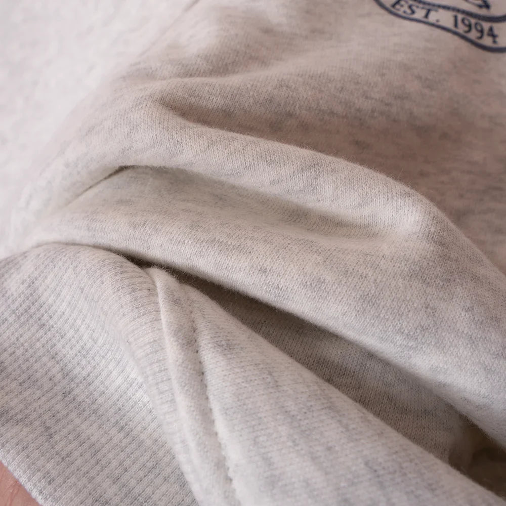 Women’s ZESSAM Club Graphic Sweatshirt by Adistore with long sleeves and a collar, featuring a stylish graphic design.