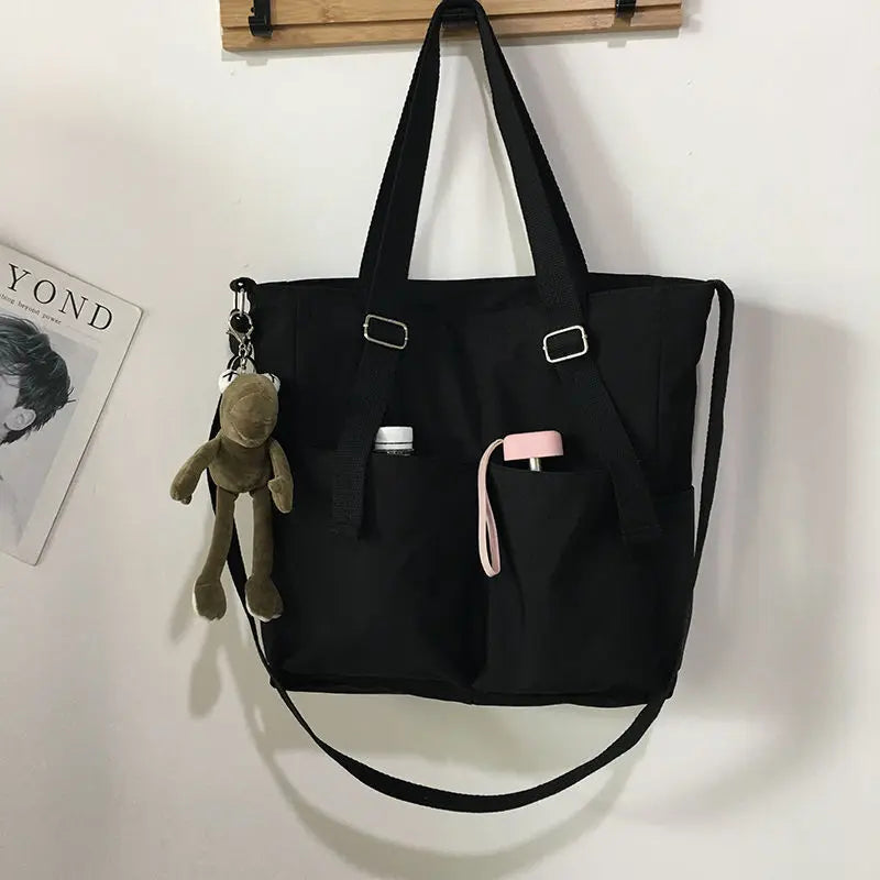 Adistore women's shopper bag with zipper, featuring a solid design, suitable as a crossbody or shoulder tote bag.
