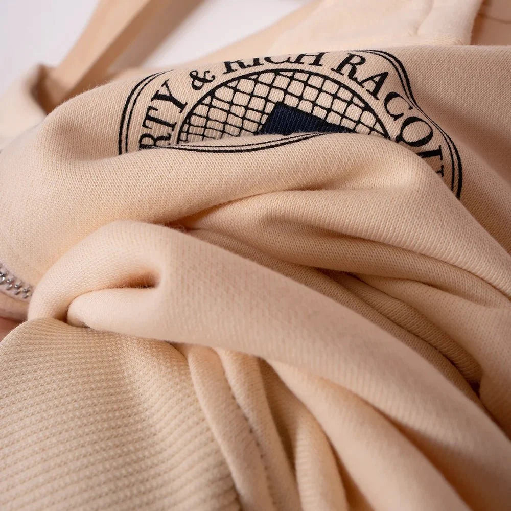 Women’s ZESSAM Club Graphic Sweatshirt by Adistore with long sleeves and a collar, featuring a stylish graphic design.