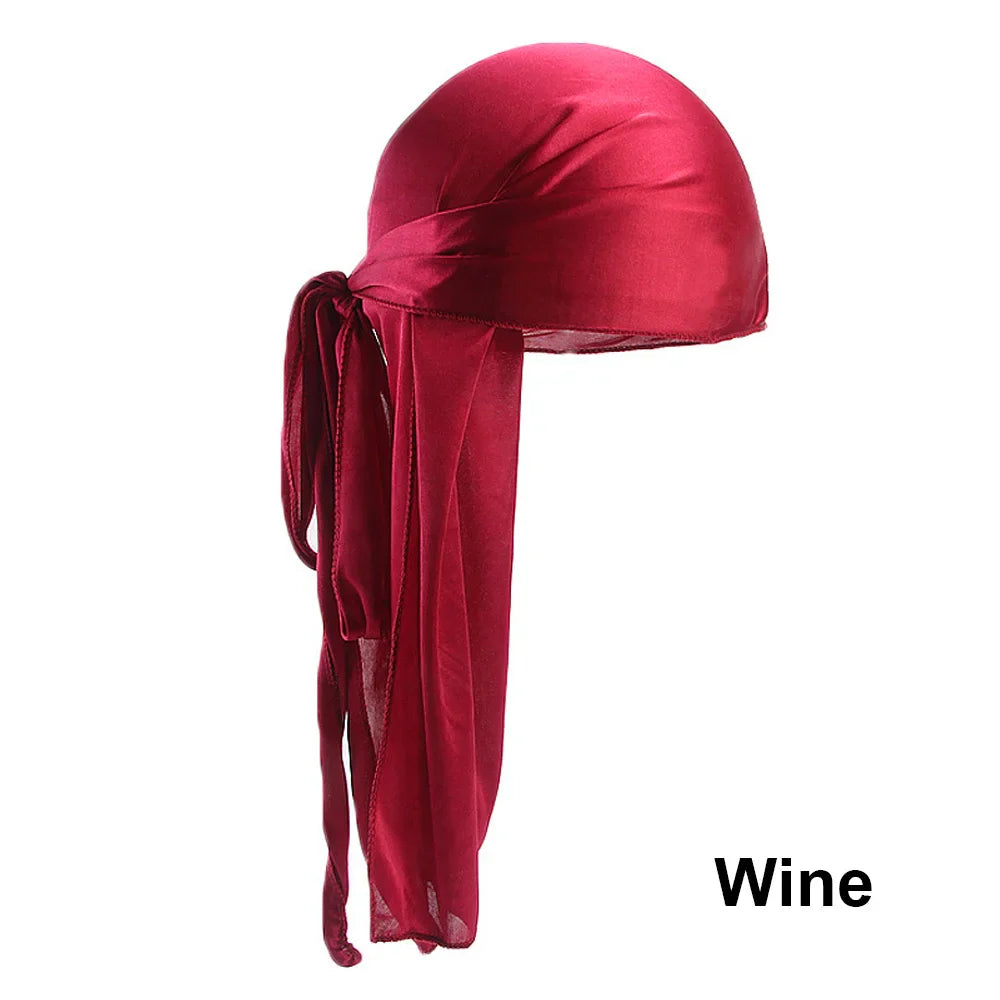Unisex satin long tail doo rag durag bandana cap with pirate and turban style, worn as hip hop or biker headwrap by men and women.