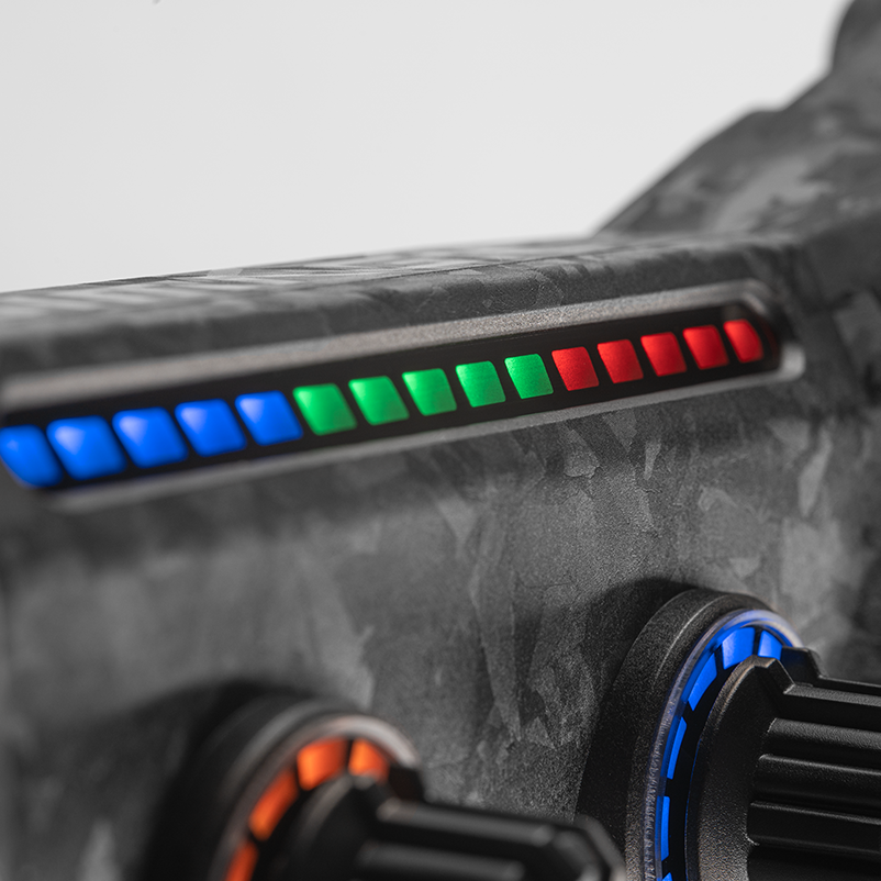 Simagic GT NEO Formula steering wheel with carbon finish, LCD display, and 12 buttons for racing simulation setups.