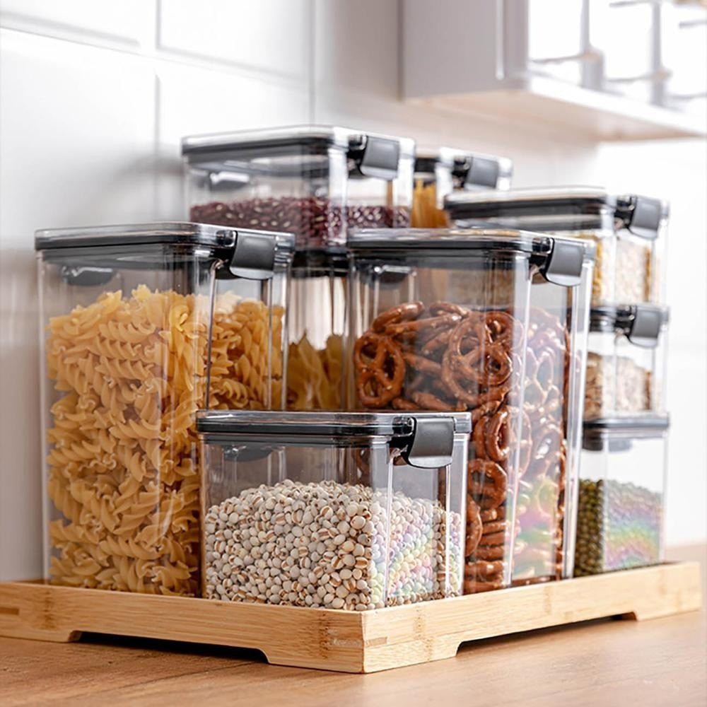 Set of Adistore airtight food storage containers with clear plastic bodies and snap-on lids, ideal for kitchen organization.