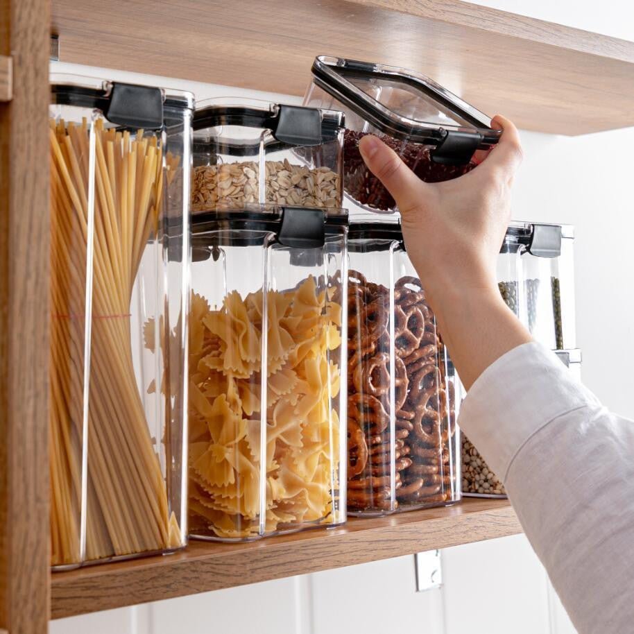 Set of Adistore airtight food storage containers and kitchen organizer boxes in clear plastic with secure lids and stackable design.
