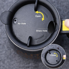 Adistore automatic self-stirring mug with stainless steel body and magnetic mixing system for coffee or beverages.