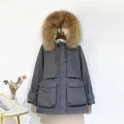 Ladies winter jacket with large natural fox fur hood, stylish women's coat by Adistore, featuring warm, plush fur trim.