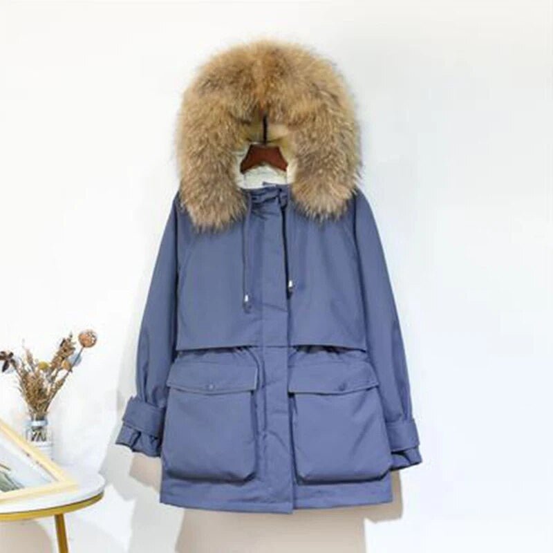 Women's winter jacket by Adistore with large natural fox fur hood, featuring a stylish and warm outerwear design.