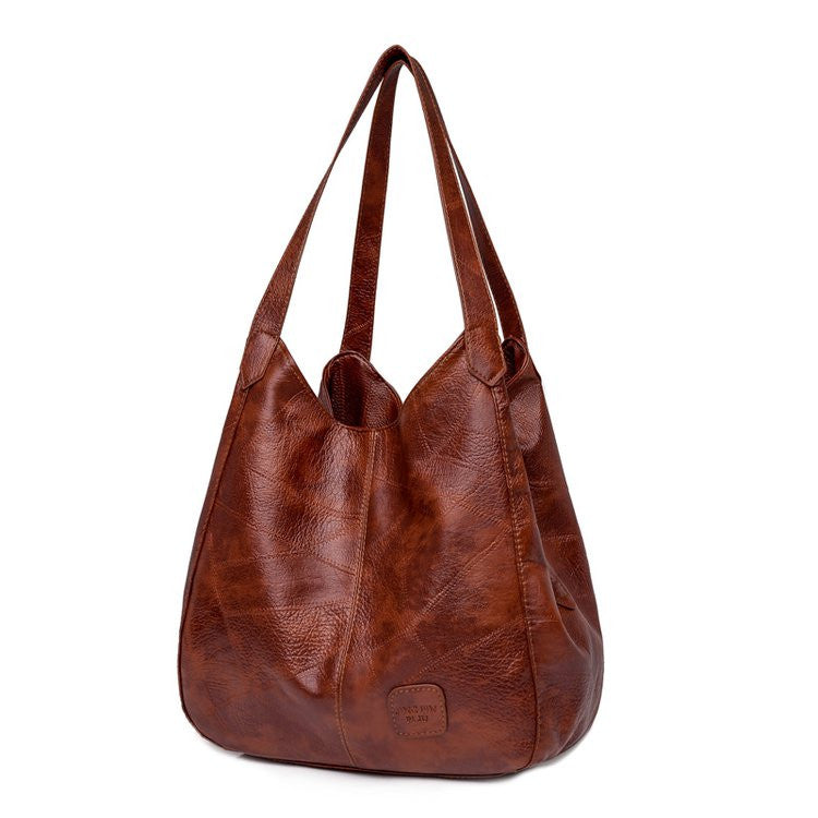 Vintage PU leather Boston handbag by Adistore, small crossbody travel purse with sturdy leather texture and compact design.