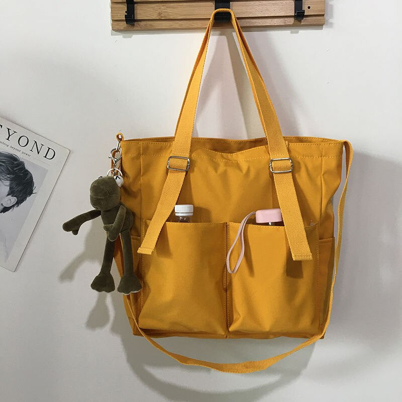 Adistore women's shopper bag with zipper, featuring a solid design, crossbody strap, and tote shoulder style for versatile use.