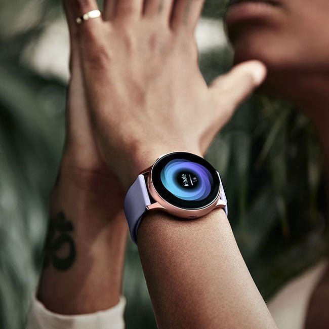 Samsung Galaxy Watch Active 2 44mm smartwatch with black band displaying activity tracking on a digital screen